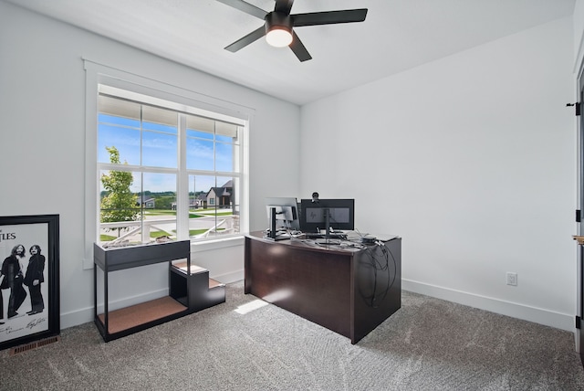 2216 Timberview Dr, Norwalk, IA 50211 - carpeted office space featuring a ceiling fan and baseboards