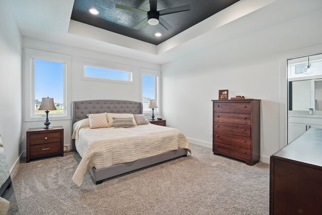 2216 Timberview Dr, Norwalk, IA 50211 - bedroom with a raised ceiling, light colored carpet, baseboards, ceiling fan, and recessed lighting