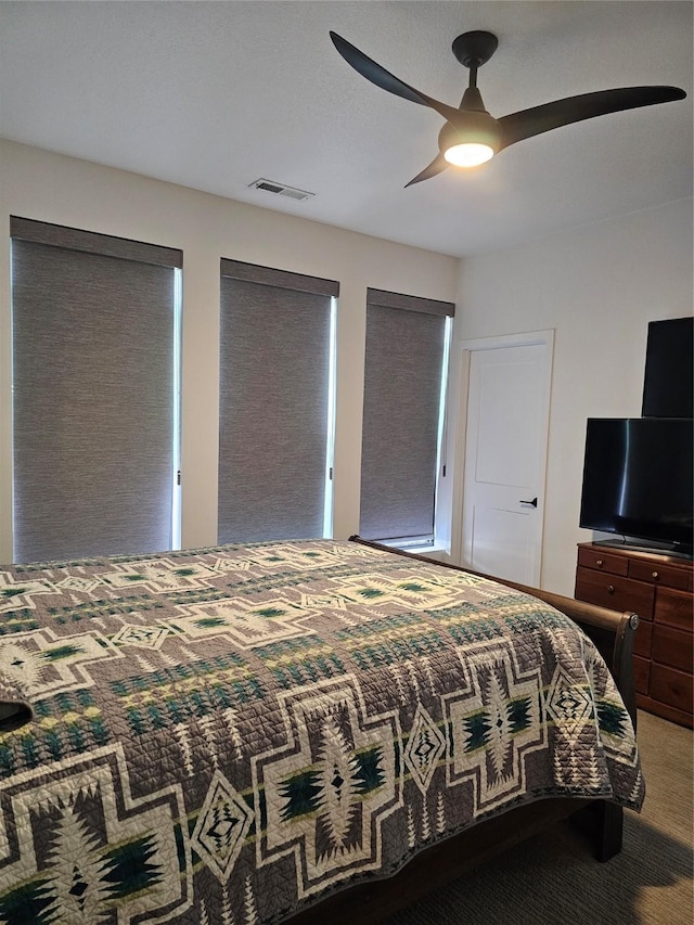 924 12th St, Des Moines, IA 50309 - carpeted bedroom featuring ceiling fan