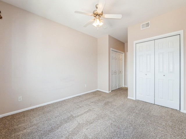 6255 Beechtree Dr Unit 4304, West Des Moines, IA 50266 - unfurnished bedroom with carpet floors, baseboards, two closets, and a ceiling fan