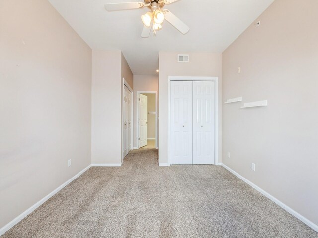 6255 Beechtree Dr Unit 4304, West Des Moines, IA 50266 - unfurnished bedroom featuring baseboards, light carpet, and ceiling fan