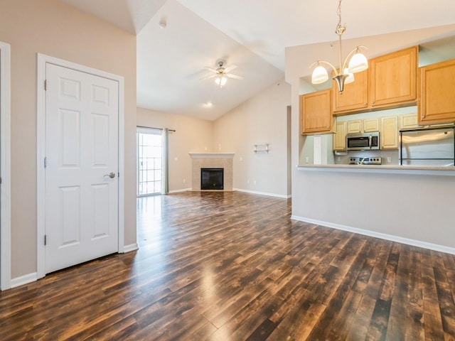 6255 Beechtree Dr Unit 4304, West Des Moines, IA 50266 - kitchen featuring stainless steel appliances, vaulted ceiling, a ceiling fan, dark wood-style flooring, and a chandelier