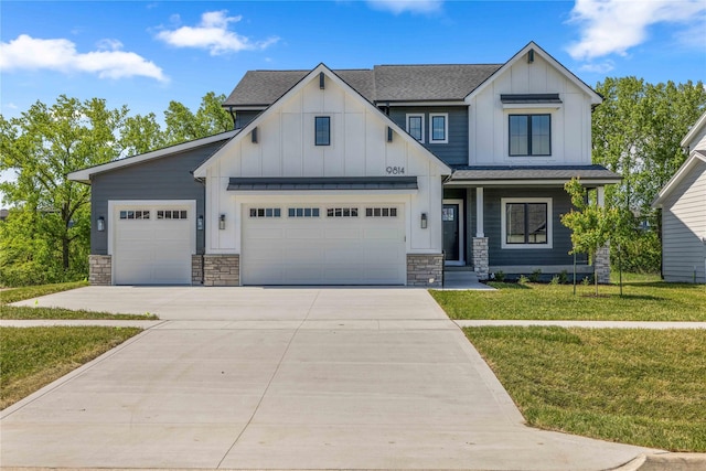 9814 Watermeadow Cir, Johnston, IA 50131 - view of front of home featuring board and batten siding, concrete driveway, an attached garage, and stone siding