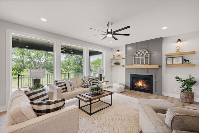 9814 Watermeadow Cir, Johnston, IA 50131 - living room with healthy amount of natural light, a ceiling fan, light wood-type flooring, and recessed lighting