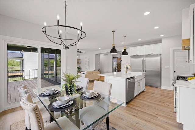 9814 Watermeadow Cir, Johnston, IA 50131 - dining space featuring a chandelier, light wood-style flooring, recessed lighting, and ceiling fan