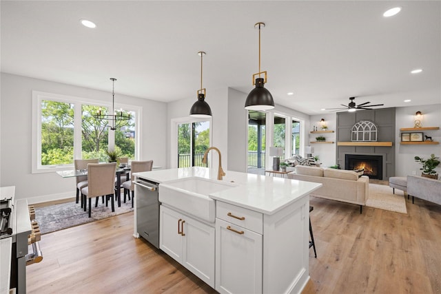 9814 Watermeadow Cir, Johnston, IA 50131 - kitchen with dishwasher, a sink, healthy amount of natural light, light countertops, and recessed lighting