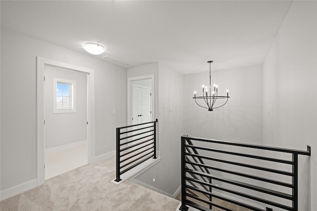 9814 Watermeadow Cir, Johnston, IA 50131 - stairway featuring a chandelier, carpet floors, and baseboards