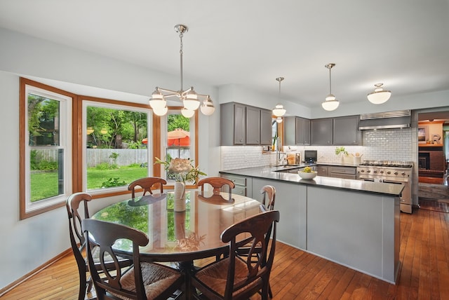 711 36th St, West Des Moines, IA 50265 - dining space with plenty of natural light, hardwood / wood-style floors, and baseboards