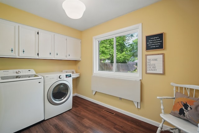 711 36th St, West Des Moines, IA 50265 - laundry room featuring washer and clothes dryer, cabinet space, dark wood-style floors, and baseboards