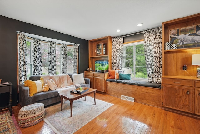 711 36th St, West Des Moines, IA 50265 - living area with light wood-style floors and recessed lighting