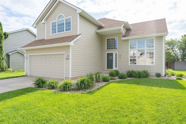 6640 Monticello Ct, Johnston, IA 50131 - traditional home with roof with shingles, a front lawn, concrete driveway, and an attached garage