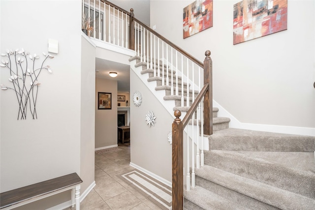 6640 Monticello Ct, Johnston, IA 50131 - stairway with tile patterned floors and baseboards