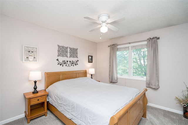 6640 Monticello Ct, Johnston, IA 50131 - bedroom featuring light carpet, baseboards, and ceiling fan