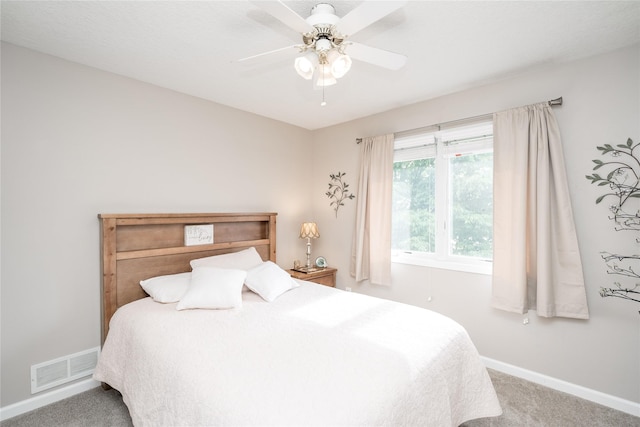 6640 Monticello Ct, Johnston, IA 50131 - carpeted bedroom with baseboards and ceiling fan