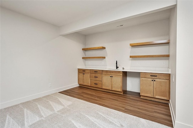 1511 Boulder Creek Ct SE, Altoona, IA 50009 - indoor bar featuring baseboards, dark wood-style flooring, and dark carpet