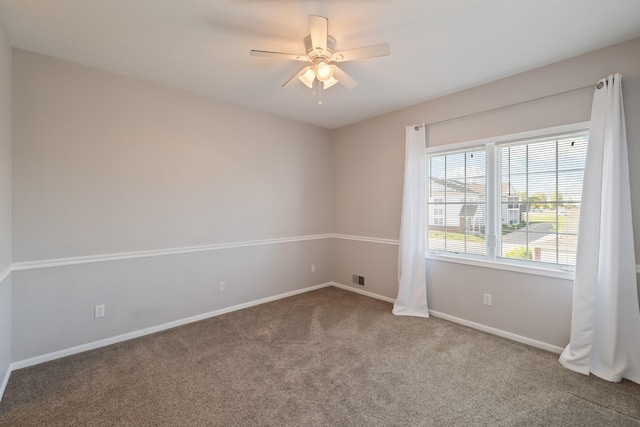 1335 SE Florence Dr Unit 312, Waukee, IA 50263 - carpeted spare room featuring a ceiling fan and baseboards