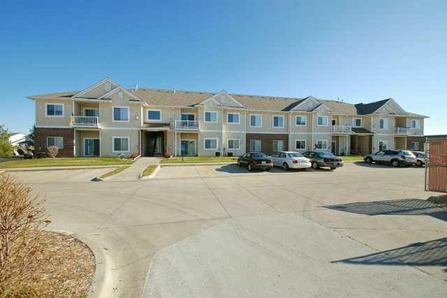 1740 SE La Grant Pkwy Unit 18, Waukee, IA 50263 - view of concrete street featuring a residential view and curbs