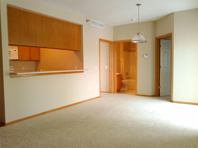 1740 SE La Grant Pkwy Unit 18, Waukee, IA 50263 - spare room featuring carpet floors and baseboards