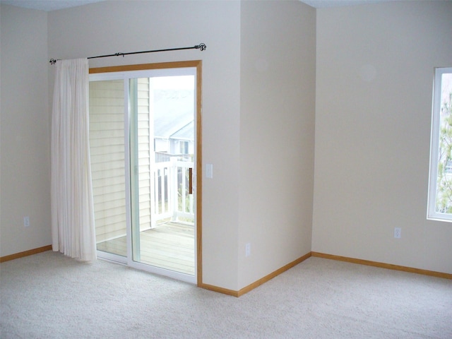 1740 SE La Grant Pkwy Unit 18, Waukee, IA 50263 - empty room with light colored carpet and baseboards