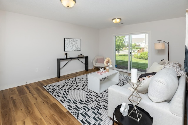 196 79th St, West Des Moines, IA 50266 - living area featuring wood finished floors and baseboards