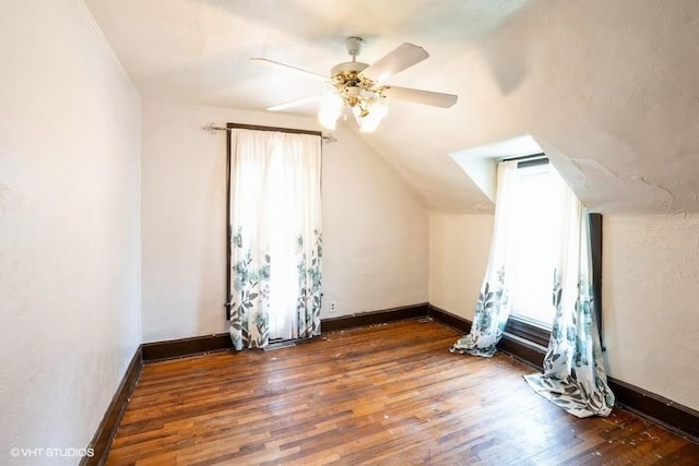 2638 Capitol Ave, Des Moines, IA 50317 - additional living space featuring wood finished floors, a ceiling fan, baseboards, and lofted ceiling