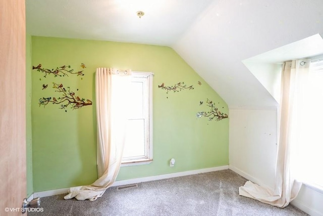 2638 Capitol Ave, Des Moines, IA 50317 - bonus room with vaulted ceiling, carpet flooring, and baseboards