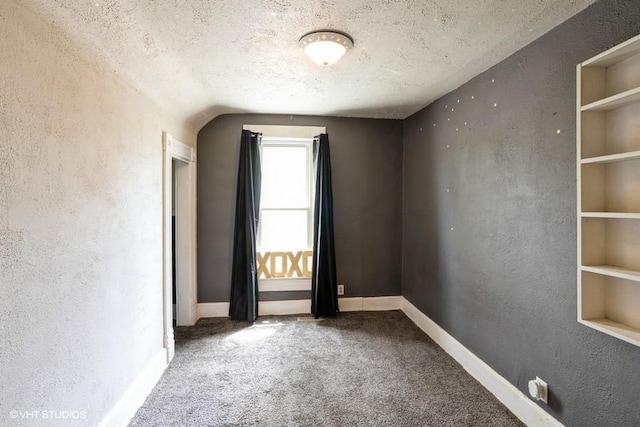 2638 Capitol Ave, Des Moines, IA 50317 - carpeted empty room featuring a textured wall and a textured ceiling