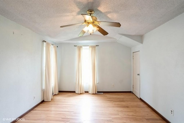 2638 Capitol Ave, Des Moines, IA 50317 - spare room featuring a ceiling fan, a textured ceiling, light wood-type flooring, and baseboards