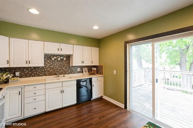 2638 Capitol Ave, Des Moines, IA 50317 - kitchen with dishwasher, a sink, dark wood-style floors, tasteful backsplash, and white cabinets