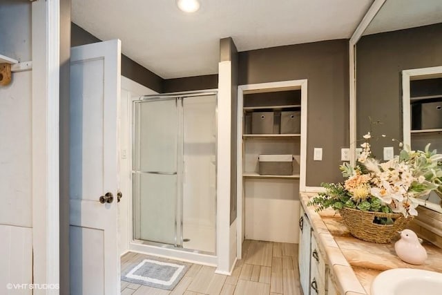 2638 Capitol Ave, Des Moines, IA 50317 - bathroom with a shower stall and double vanity