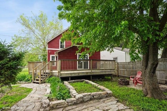 2638 Capitol Ave, Des Moines, IA 50317 - back of property with an outdoor fire pit and a deck