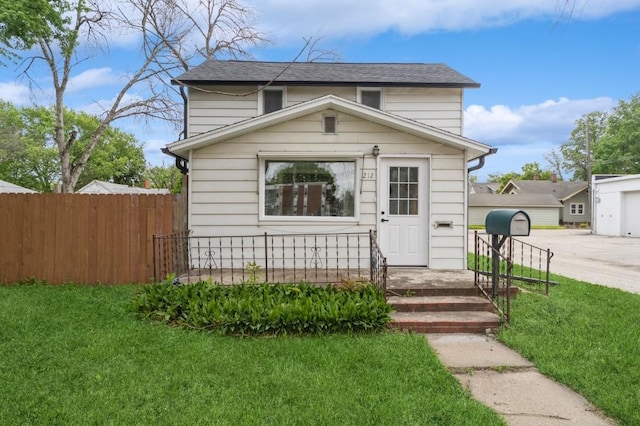212 Nile Kinnick Dr N, Adel, IA 50003 - view of front of house with a shingled roof