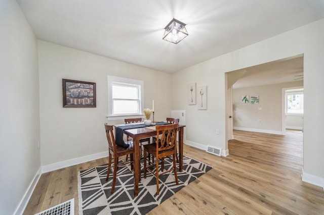 212 Nile Kinnick Dr N, Adel, IA 50003 - dining area featuring wood finished floors and baseboards