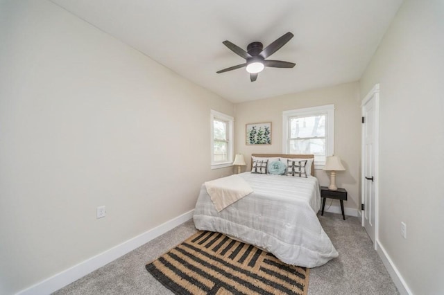 212 Nile Kinnick Dr N, Adel, IA 50003 - carpeted bedroom featuring baseboards and ceiling fan