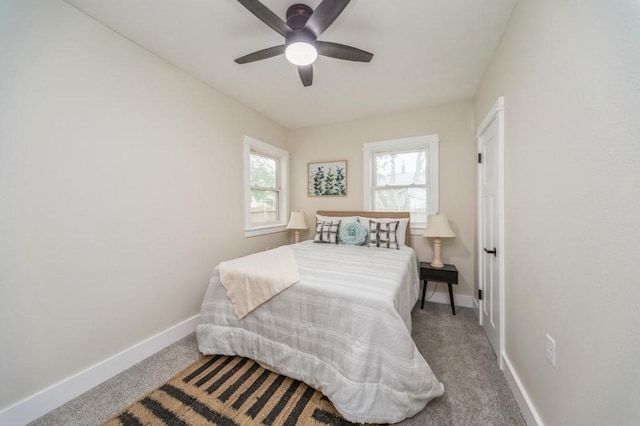 212 Nile Kinnick Dr N, Adel, IA 50003 - carpeted bedroom featuring baseboards and a ceiling fan