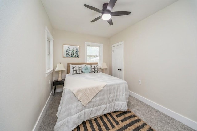 212 Nile Kinnick Dr N, Adel, IA 50003 - bedroom featuring carpet floors, baseboards, and ceiling fan