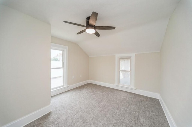 212 Nile Kinnick Dr N, Adel, IA 50003 - additional living space featuring vaulted ceiling, carpet flooring, a ceiling fan, and baseboards