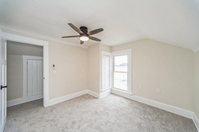 212 Nile Kinnick Dr N, Adel, IA 50003 - additional living space featuring a ceiling fan, carpet floors, baseboards, and vaulted ceiling