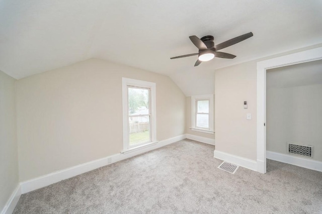 212 Nile Kinnick Dr N, Adel, IA 50003 - bonus room with carpet flooring, a ceiling fan, lofted ceiling, and baseboards