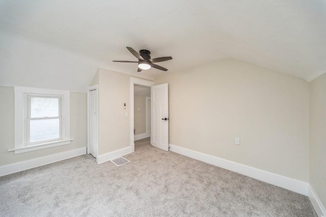 212 Nile Kinnick Dr N, Adel, IA 50003 - additional living space featuring vaulted ceiling, ceiling fan, carpet, and baseboards