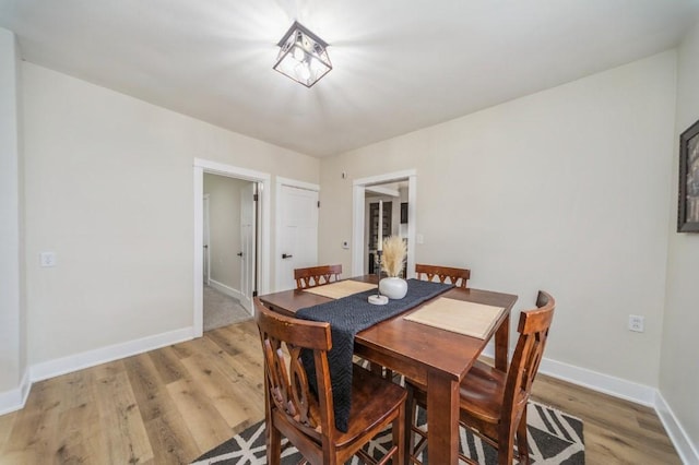 212 Nile Kinnick Dr N, Adel, IA 50003 - dining room with light wood finished floors and baseboards