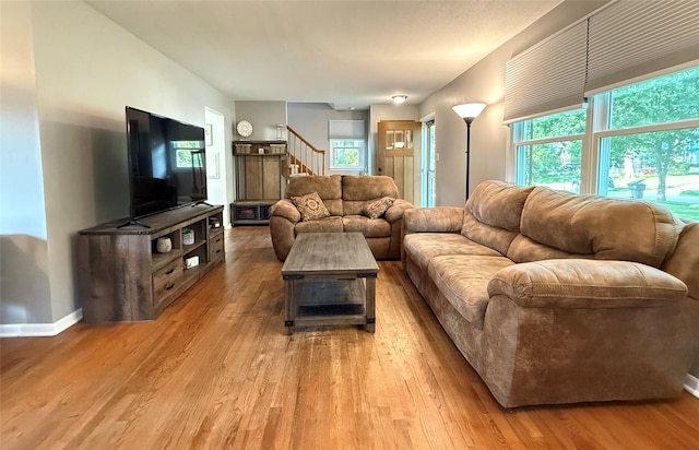 1541 42nd St, Des Moines, IA 50311 - living area featuring wood finished floors and stairs
