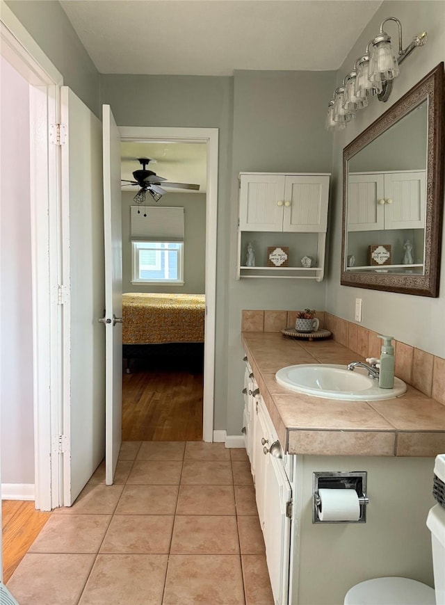 1541 42nd St, Des Moines, IA 50311 - ensuite bathroom featuring vanity, tile patterned floors, and ceiling fan