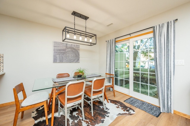 5221 Village Run Ave Unit 402, Des Moines, IA 50317 - dining space with wood finished floors and baseboards