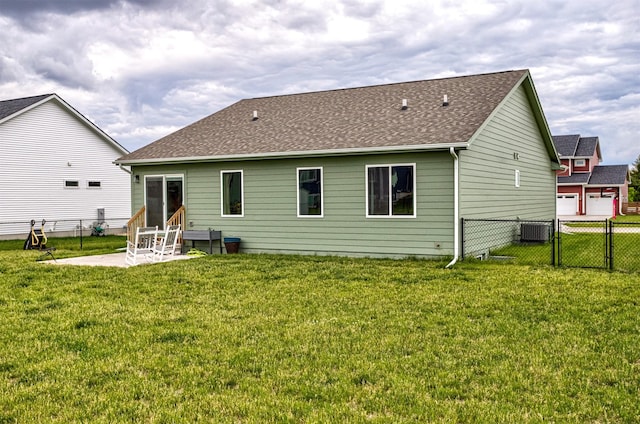 513 Walnut Dr, Huxley, IA 50124 - back of property featuring entry steps, central AC, a patio, a shingled roof, and a gate