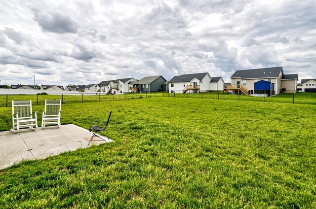 513 Walnut Dr, Huxley, IA 50124 - view of yard with a residential view and a patio area