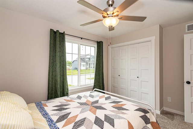 513 Walnut Dr, Huxley, IA 50124 - carpeted bedroom with a closet, a ceiling fan, and baseboards