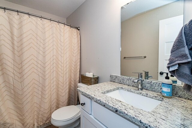 513 Walnut Dr, Huxley, IA 50124 - bathroom with toilet, vanity, and a shower with shower curtain