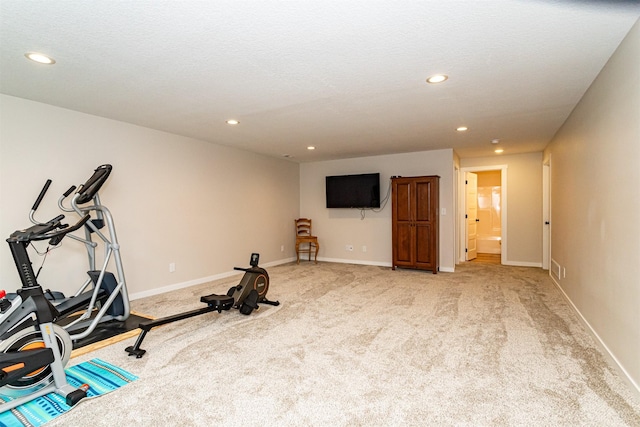 513 Walnut Dr, Huxley, IA 50124 - exercise area featuring recessed lighting, light colored carpet, and baseboards