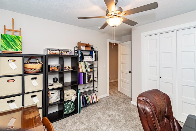 513 Walnut Dr, Huxley, IA 50124 - carpeted home office with a ceiling fan and baseboards